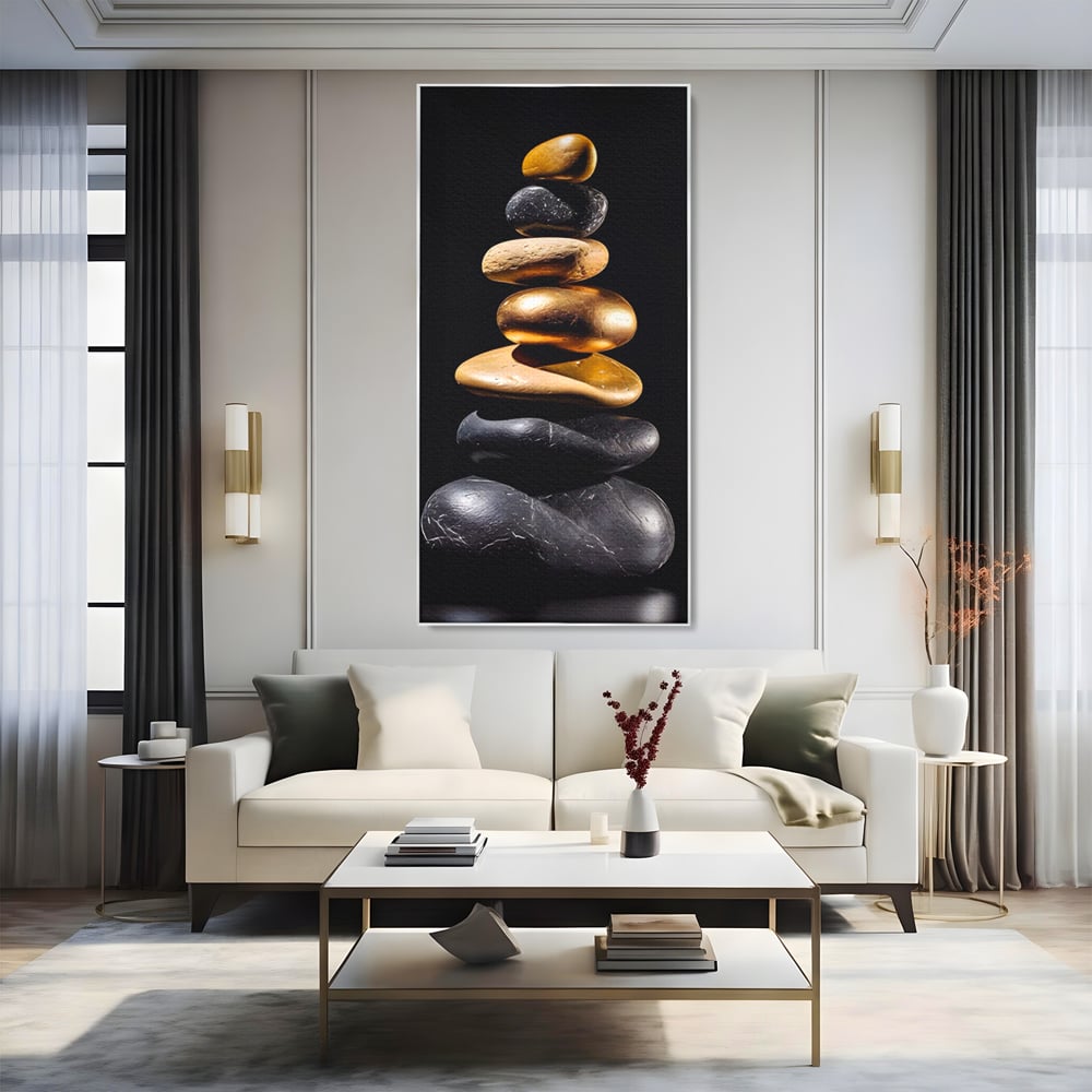 Tablou canvas cu turn vertical din pietre suprapuse, in rama de aluminiu argintiu, pe perete intr-un living